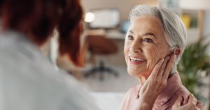 Older lady with cochlear implants.